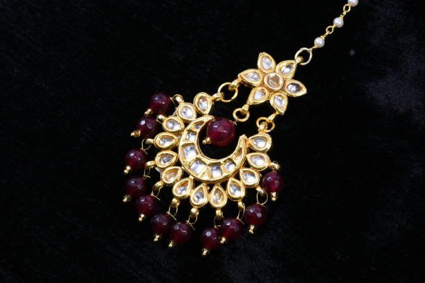 Fancy and colorful Head jewelry macro image on black background